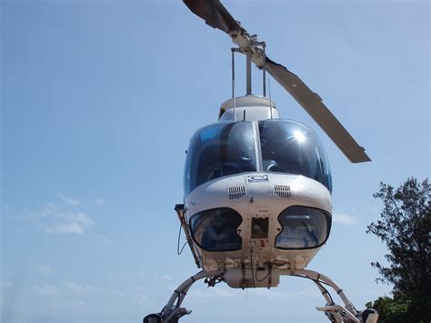 Free Image Of Front View Of Landed Helicopter With Blue Sky Freebie