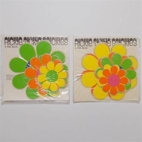 Two Pieces Of Paper With Different Colored Flowers On Them One Is