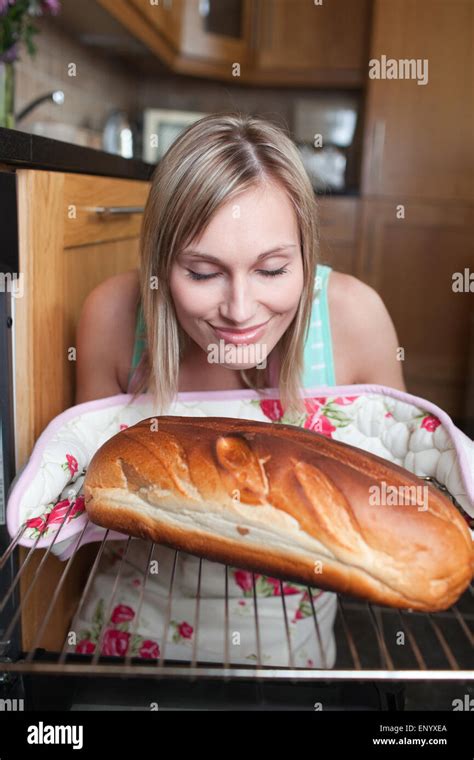 Delighted Blond Woman Baking Bread Stock Photo Alamy