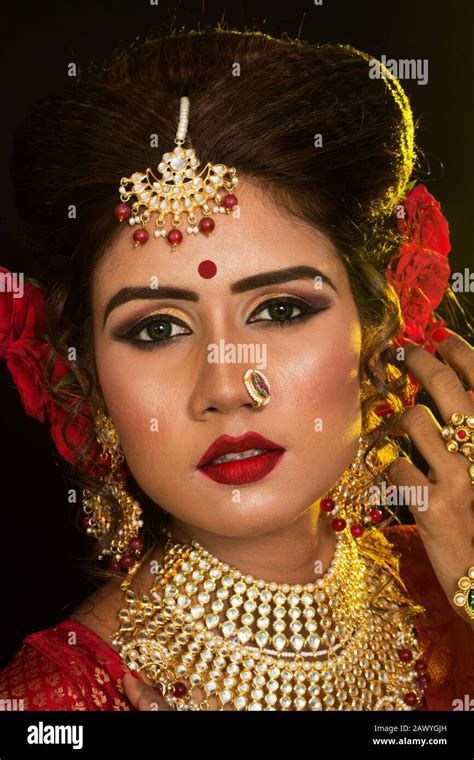 Portrait Of An Young And Beautiful Indian Bengali Brunette Woman In Red