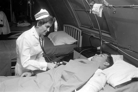 Nurse Treating Soldier In Hospital During The Vietnam War Image Free