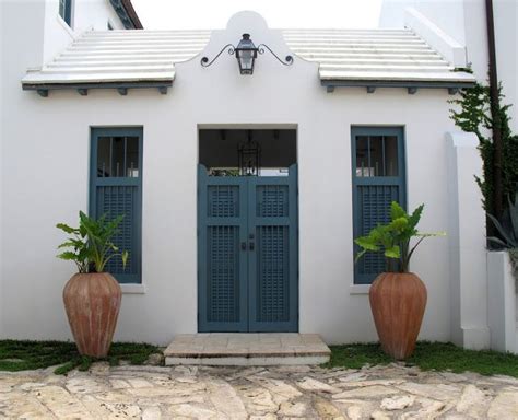 White Stucco And Painted Shutters Sea Breezes And Palm Trees