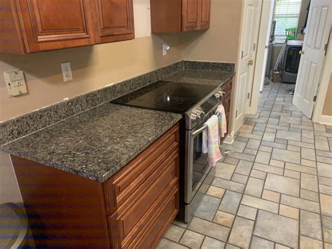 Stunning kitchen update with white cabinets and blue pearl granite counters. BLUE PEARL - DIY Cabinets and Granite