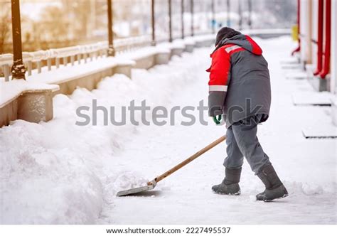 Man Shovel Shoveling Snow Sidewalk After Stock Photo 2227495537