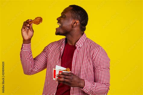 Black Man Eating Chicken