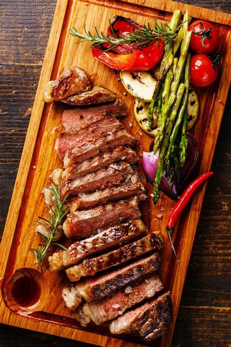 Sliced Grilled Steak Striploin And Vegetables Stock Photo Image Of