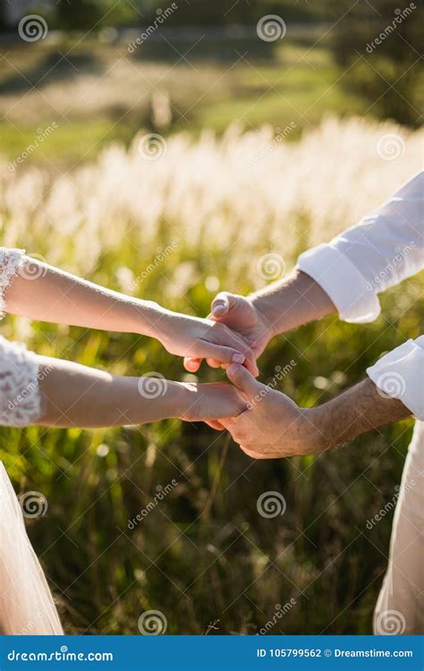 Young Bride And Groom Couple In Garden Love And Tenderness Stock Photo