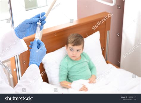 Doctor Adjusting Intravenous Drip Little Child Stock Photo 1306501993
