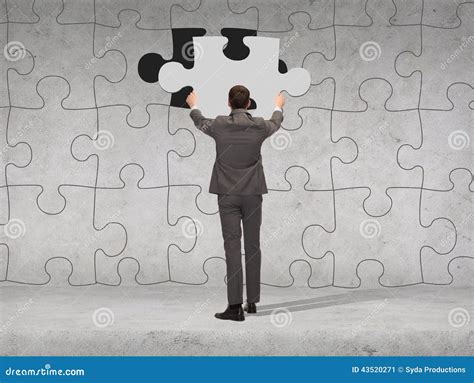 Businessman In Suit Setting Piece Of Puzzle Stock Image Image Of