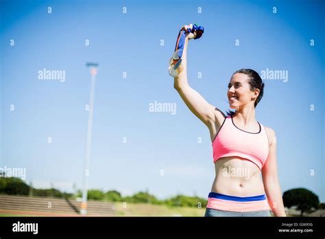 Female Athlete Showing Her Gold Medals Stock Photo Alamy