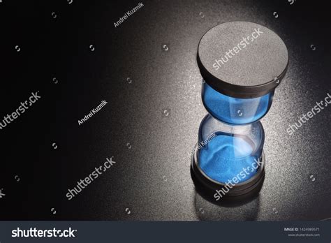 Hourglasses Blue Sand Measuring Passage Time Stock Photo 1424989571