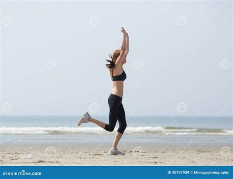 Runner Celebrating With Arms Raised In Success Stock Image Image Of
