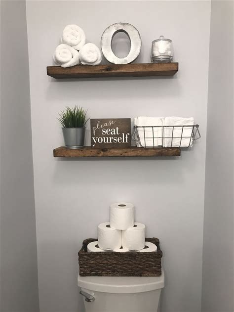 The sink came from lowe's and she just switched out hardware from amazon. Half Bathroom Decor !. wood shelves and toilet paper in a ...