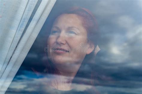 Woman Looking Through The Window On A Rain Day Stock Photo Image Of