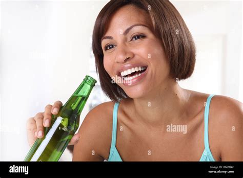 Woman Drinking Beer From Bottle Stock Photo Alamy