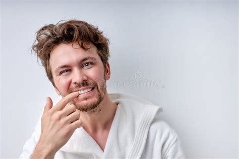 Healthy Caucasian Young Man Looking At Camera Checking Is Mouth And