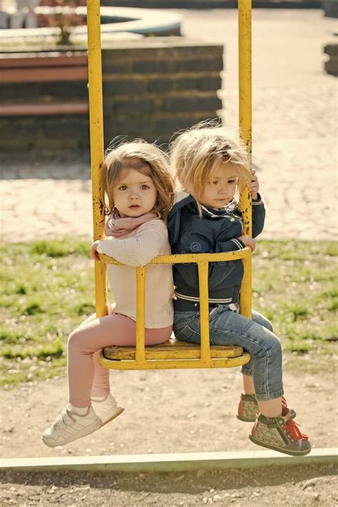 brother and sister on swing on sunny day stock image image of lifestyle spring 129182665