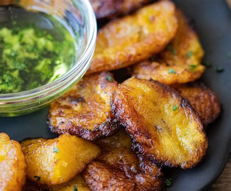 Traditional Dominican Green And Yellow Fried Plantains With Mojo Sauce
