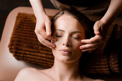 Neck And Face Massage In The Spa Masseur Is Making Facial Beauty