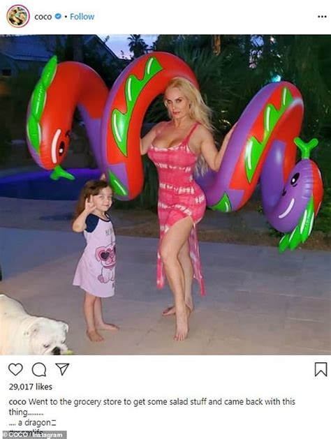 Coco Austin 41 Looks Curvy As She Poses With A Large Dragon Blowup