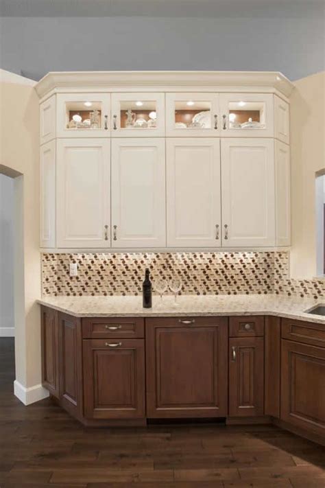 To optimize the elegant impression of cherry kitchen cabinets, you must be smart in adjusting the color contrast in the kitchen. Cabinetry: Dura Supreme Alectra. A combination of white ...