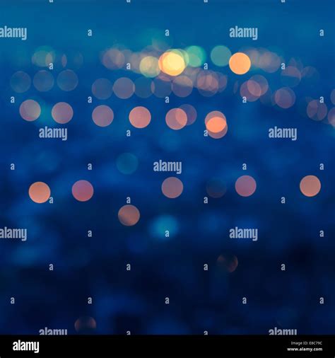 City Blurring Lights Abstract Circular Bokeh Blue Background With