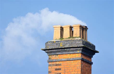 Wood Smoke Billowing From Chimney Of Old Uk House Stock Image Image