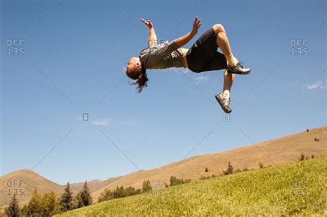 Young Athletic Man Doing Back Flip Outdoors Stock Photo Offset