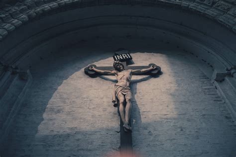 Download Jesus On Cross Outside Church Wall Wallpaper