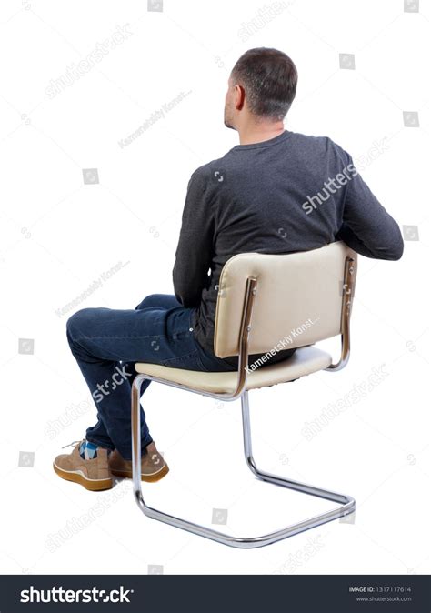 Side View Of A Man Sitting On A Chair Rear View People Collection