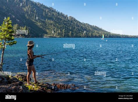 A Woman Fishing During Sunset In Lake Tahoe Nevada Stock Photo Alamy