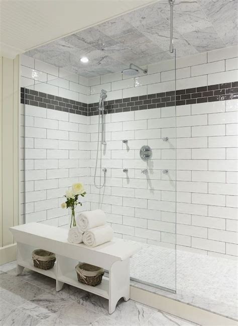 Bathroom With Walk In Shower Tiled With Large White Tile Laid In A Staggered Pattern With An
