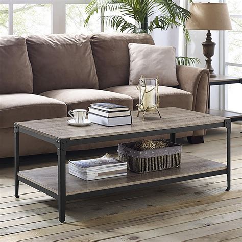 A coffee table with storage can help reduce clutter by adding extra space for remotes, throw pillows, magazines, and toys. Driftwood Angle Iron Rustic Wood Coffee Table | Walmart Canada