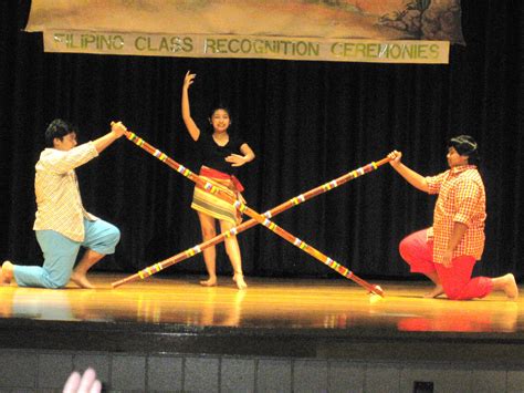 Traditional Bamboo Dance In The Philippines Also Known As Tinikling