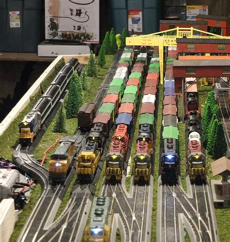 A Model Train Set With Many Trains On The Tracks
