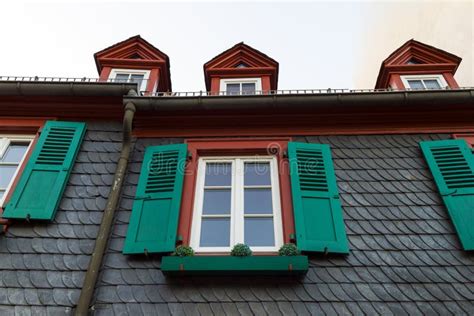 European Windows With Green Wooden Shutters In Old House Outdoors