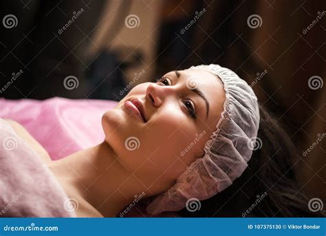 Calm Girl Having Spa Facial Massage In Luxurious Beauty Salon Stock