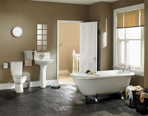 Dark hardwood flooring grounds a gold chandelier. Four Types of Toilets