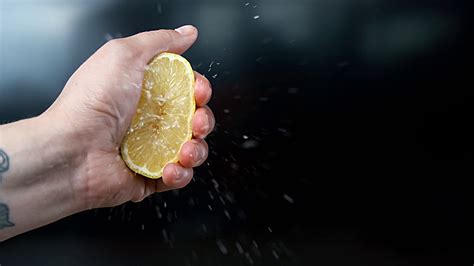 Male Hand Squeezing Half Of Lemon Fruit Stock Footage Sbv 338899655