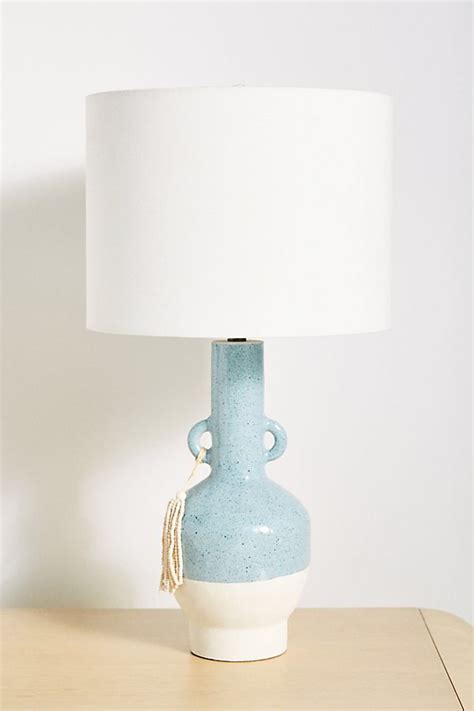 A glass globe is suspended beneath this arm in a seamless fashion and is available in clear, frosted or smoked finish. Albany Table Lamp | Table lamp, Lamp, White table lamp