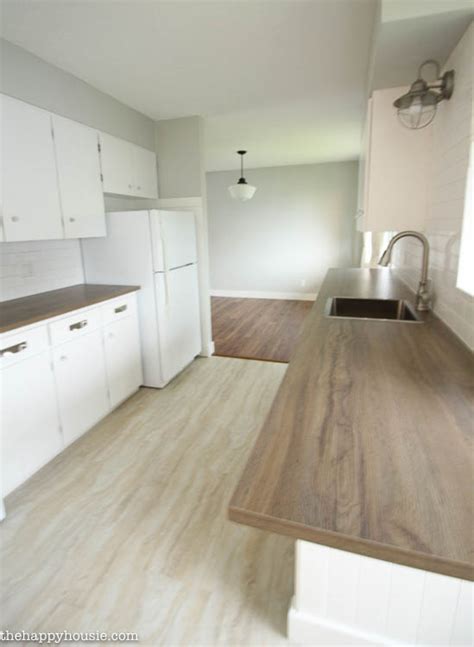 Turn the adjusting screws clockwise with a screwdriver in each set of hinges to move the door closer to the edge of the cabinet. How to Install New Countertops on Old Cabinets | The Happy ...