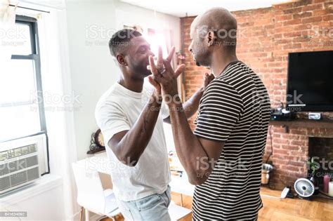 Gay Couple Embracing In The House Stock Photo Download Image Now Istock