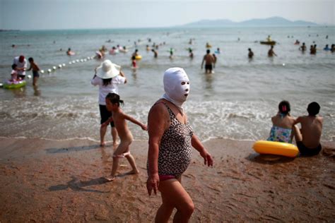In China Sun Protection Can Include A Mask The New York