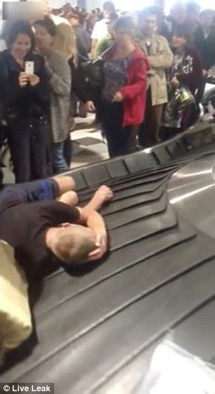 Tourist In Russia Takes A Nap On The Airport Baggage Reclaim Machine