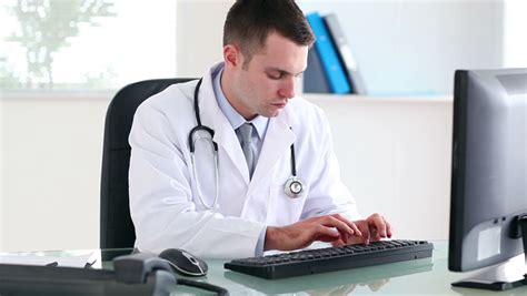 Doctor Using a Computer in Stock Footage Video (100% Royalty-free ...