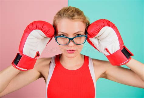 smart and strong woman boxing gloves adjust eyeglasses win with strength or intellect stock