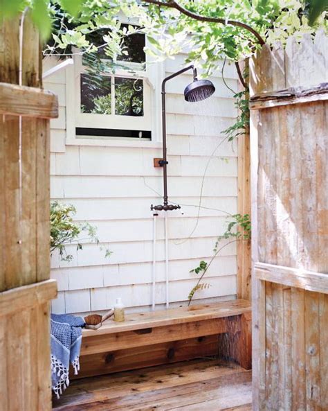 Great Outdoor Shower Ideas for Refreshing Summer Time - Hative This tiny shower corner makes the best of the pebbled flooring, matching gray walls and a contrasting white sink!