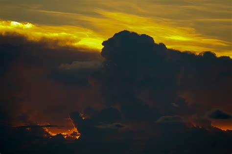 Sunset Sky Back On Dark Silhouette Cloud Red Lava Flame Hole Of Sun Ray