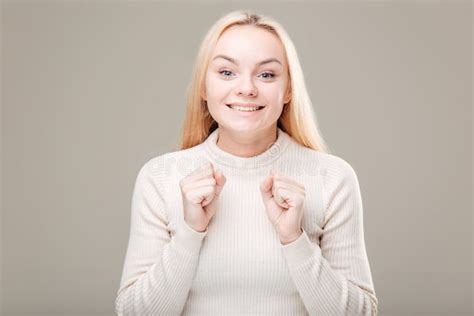 Surprised Young Woman Shouting Over Grey Background Looking At Camera