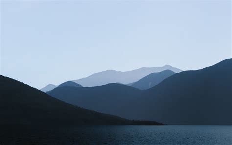Photo Of Mountains Near Body Of Water · Free Stock Photo